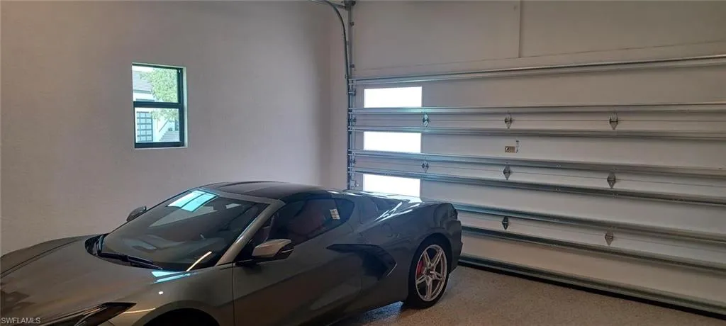 19' x 24' garage dimensions, wind rated door with sidelights and 12'-6" ceiling height. Side bar auto garage door opener is quiet and not over any vehicles.