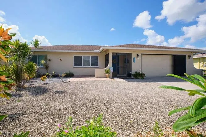 Ranch-style home featuring a garage
