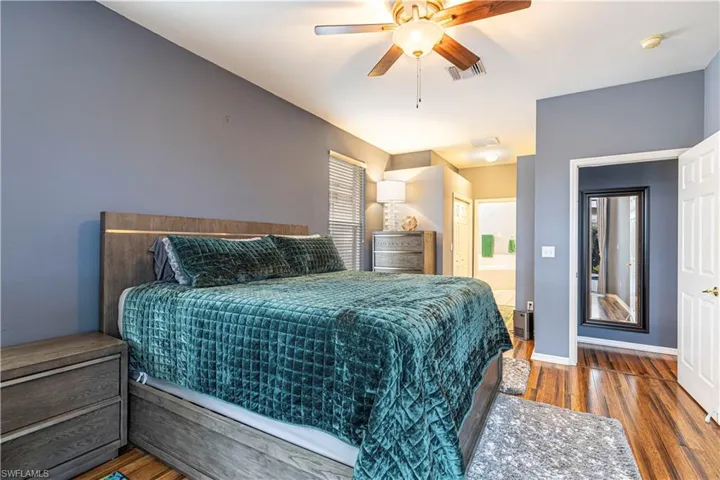 Large Master Suite with 2 walk in closets and ceiling fan