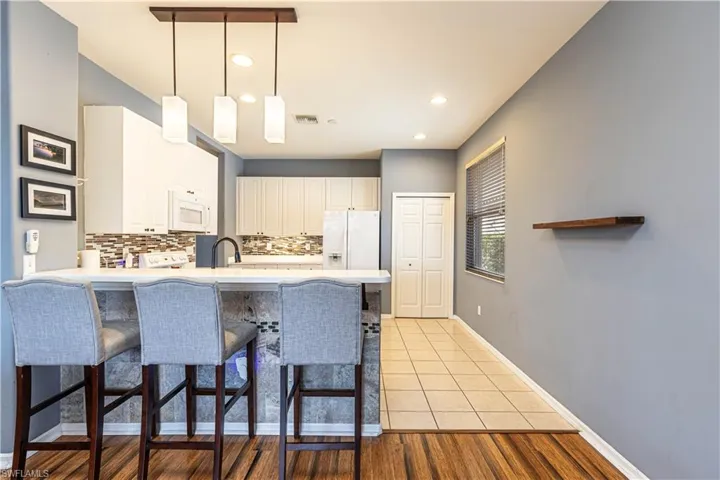Kitchen with breakfast bar and large pantry