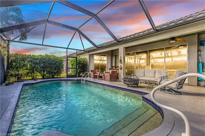 Pool at dusk with large covered area