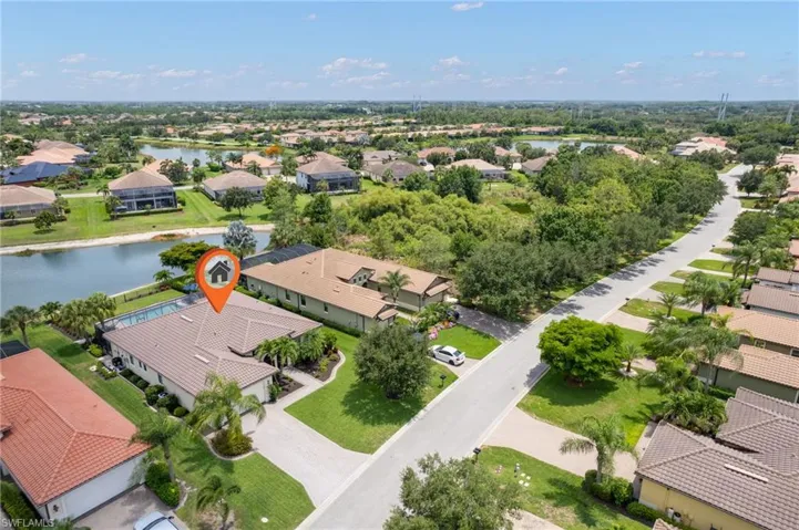 Aerial view of residential area featuring a large body of water