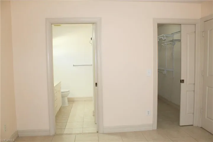 Bathroom featuring light tile patterned floors and vanity