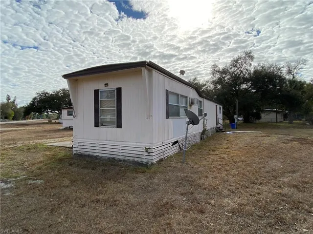 View of home's exterior with a lawn