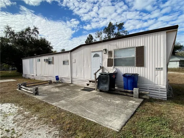 Rear view of house with a patio and entry steps