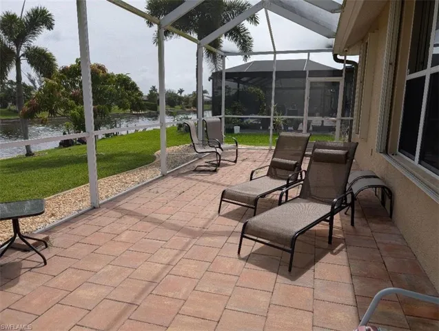 Sunroom with a water view