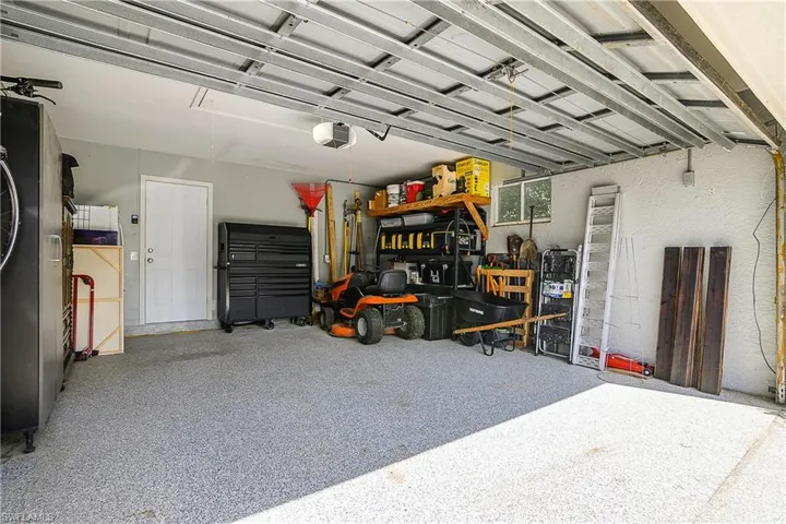 Garage featuring a garage door opener
