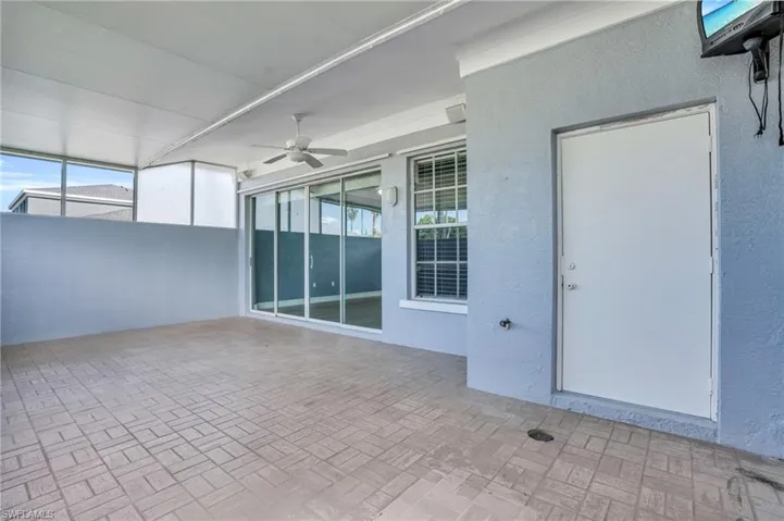 View of patio featuring ceiling fan