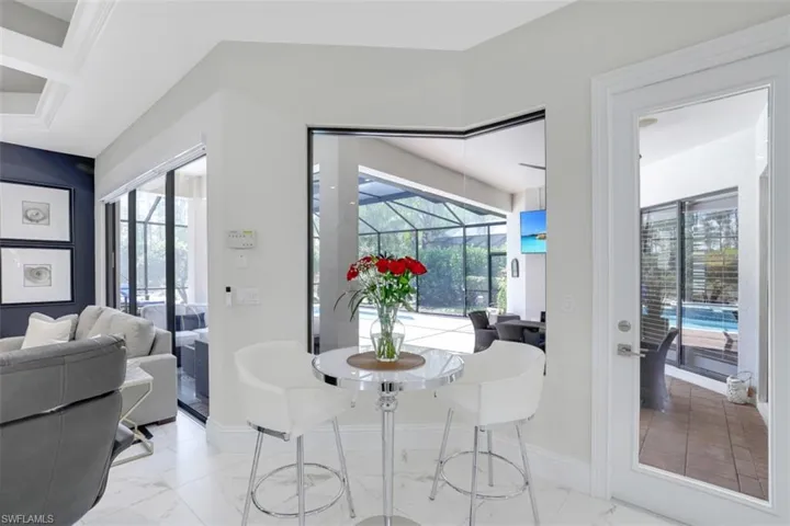 Breakfast nook and light tile flooring