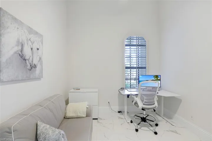 5th bedroom or office space with tile floors and high ceilings with closest