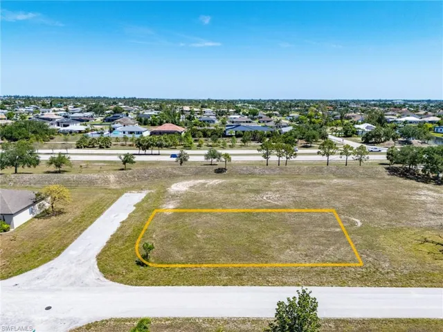 Aerial view of residential area with property parcel outlined