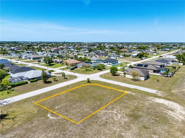 Aerial perspective of suburban area featuring property boundaries highlighted