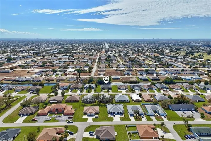 Aerial view of residential area with a nearby body of water