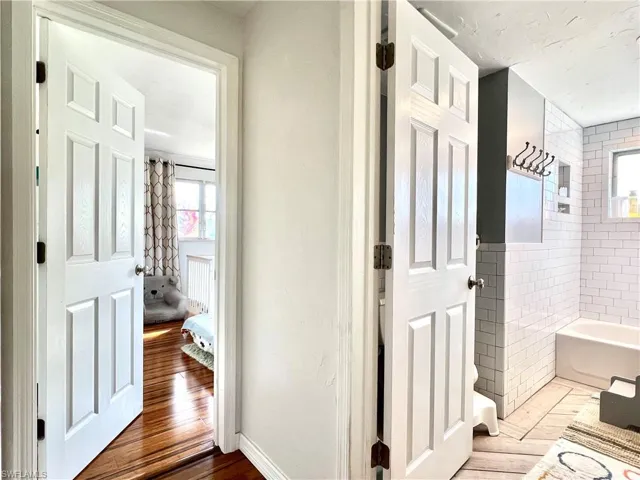 Bathroom featuring hardwood / wood-style floors and a bathtub
