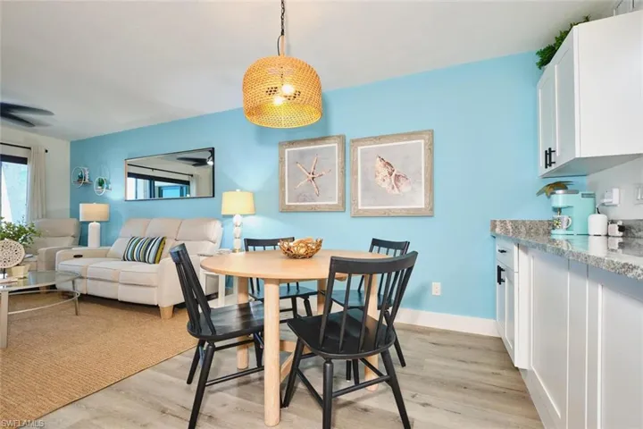 Dining space with light wood-type flooring and a ceiling fan