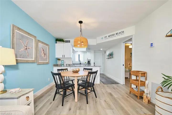 Dining room featuring light wood-style floors and baseboards