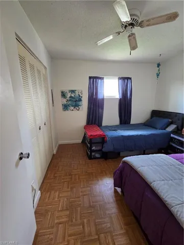 The guest bedroom has ample space and a closet for storage.