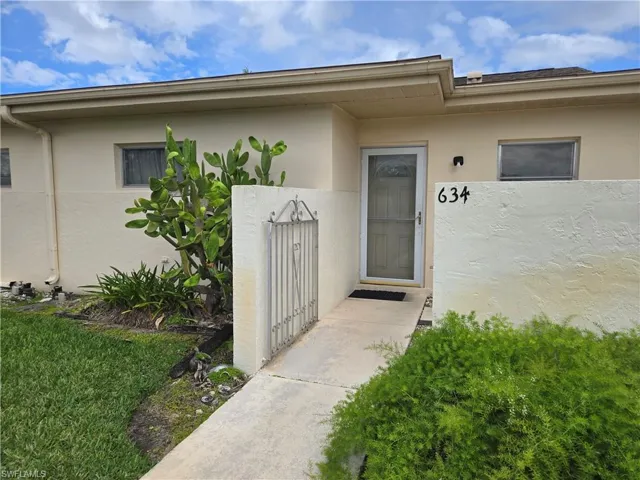 Front courtyard with decorative gate.