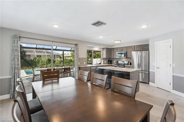 Dining room featuring light tile flooring and sink