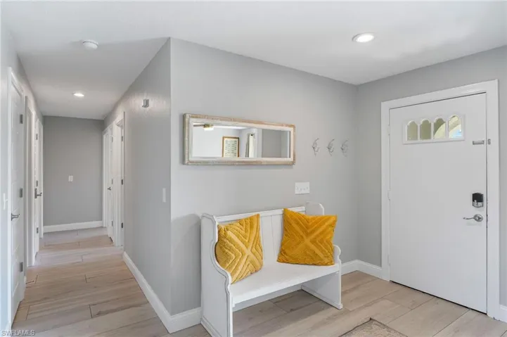 Entryway with light tile flooring