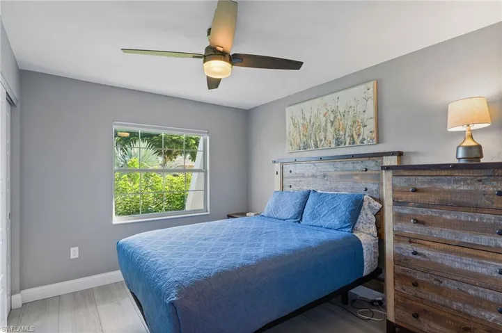 Guest Bedroom featuring ceiling fan and tile flooring