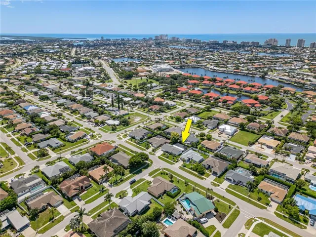 Aerial view of property featuring a water view