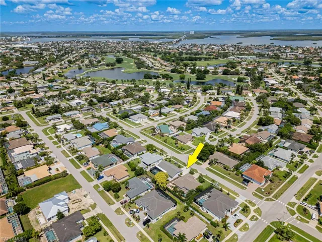 Aerial view of property featuring a water view