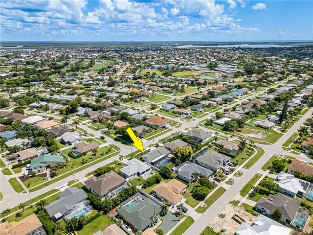 Aerial view of property featuring a water view