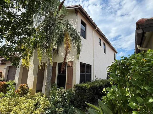 View of property exterior with stucco siding