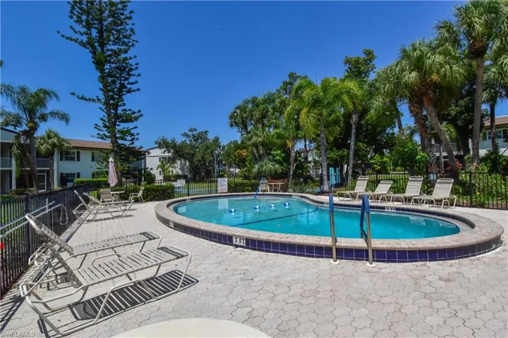 Community pool with a patio area