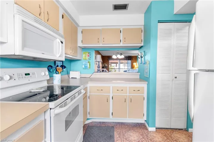 Kitchen featuring plenty of cabinets and a pantry
