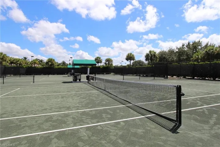 View of tennis court with fence