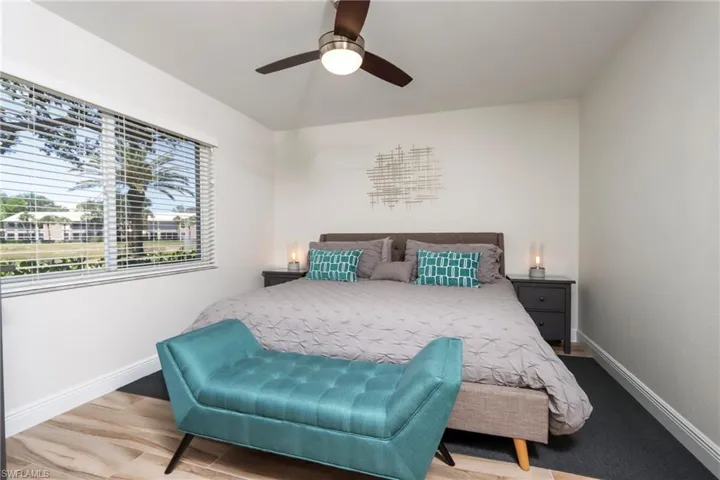 Bedroom with baseboards and ceiling fan