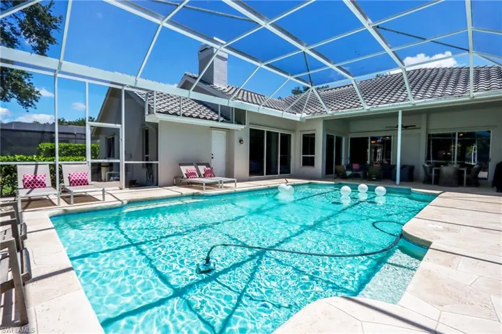 Outdoor pool with a patio and sundeck.
