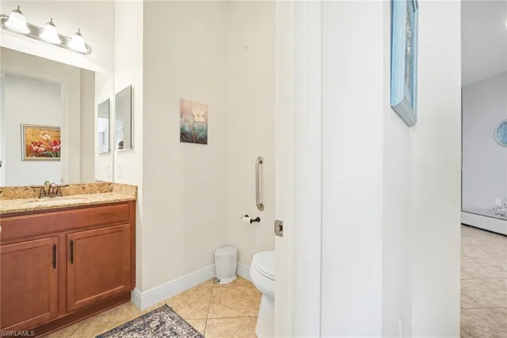 Bathroom with vanity and light tile patterned floors