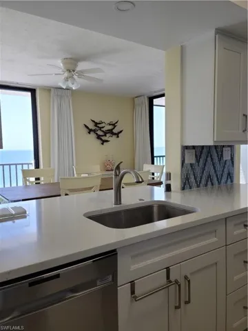 Direct gulf views from the kitchen pass through to the dining room.