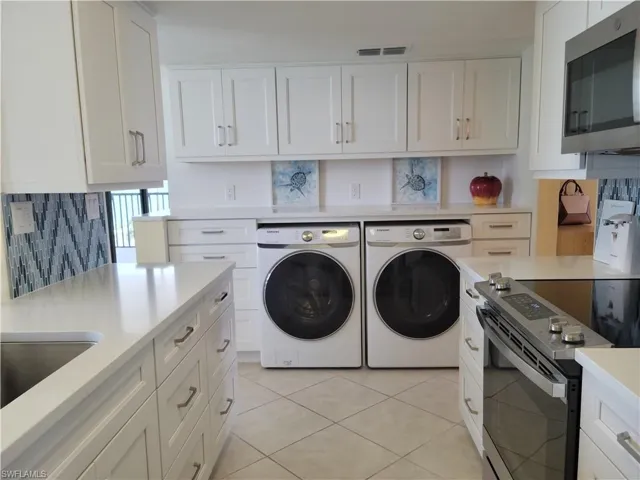 Full size washer and dryer with plenty of countertop for folding!
