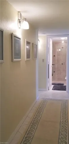 Hall leads to the privacy of the master suite, 2 guest bedrooms and bath.