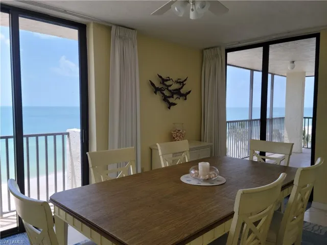 Dining room between kitchen and living room with gulf views in two directions