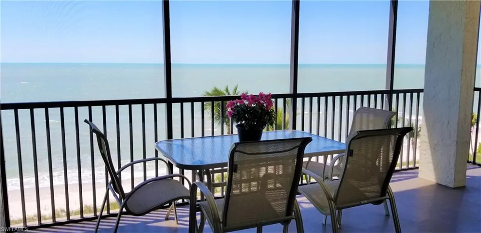 A spacious wrap around screened lanai overlooks long beach views all the way to Fort Myers Beach.