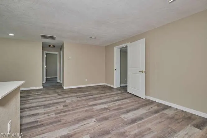 Unfurnished room with wood-type flooring