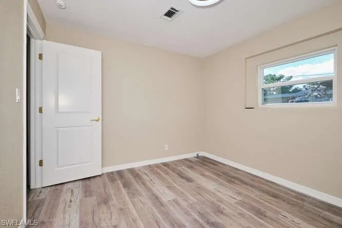 Empty room featuring light hardwood / wood-style flooring