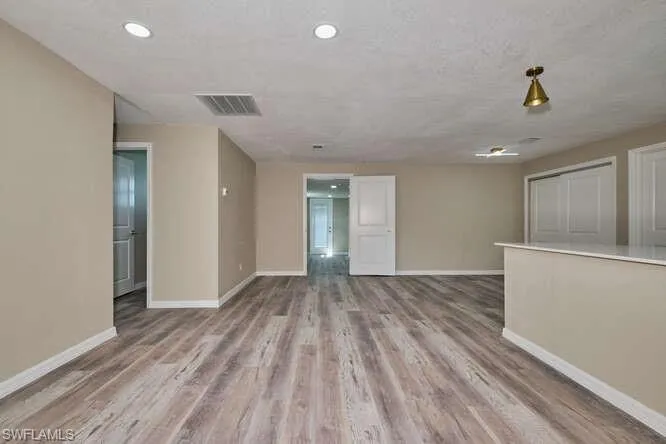 Empty room featuring light wood-type flooring