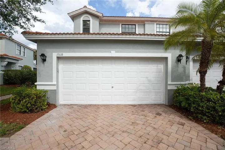 Garage with decorative driveway