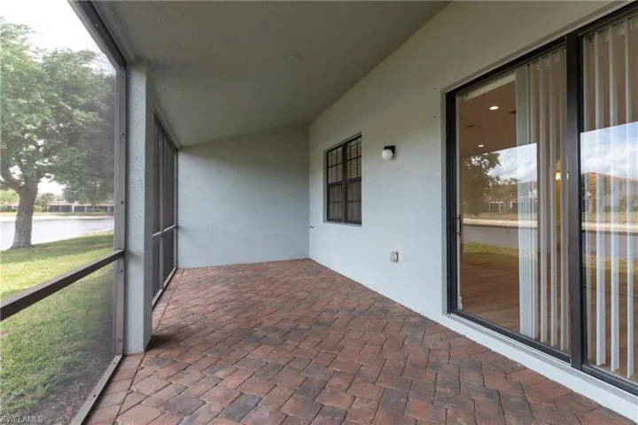 Unfurnished sunroom featuring a water view