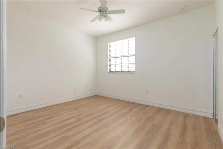Bedroom featuring light wood-style flooring and a ceiling fan