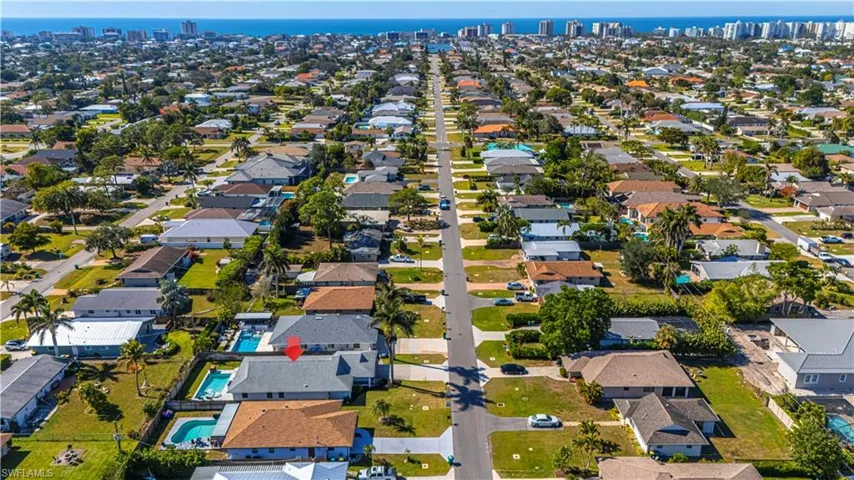 Aerial overview of property's location with nearby suburban area