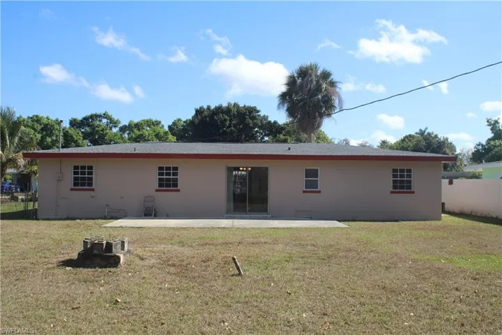 Rear view of house with a patio and stucco siding