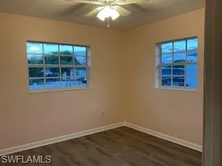 Bedroom freshly painted, Luxury Vinyl Flooring.  Two large windows