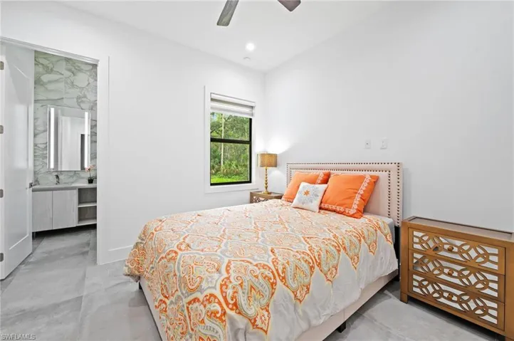 Bedroom featuring recessed lighting, a ceiling fan, and concrete floors